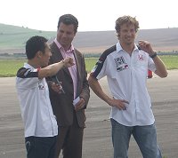 Takuma Sato and Jenson Button in Swindon 2004